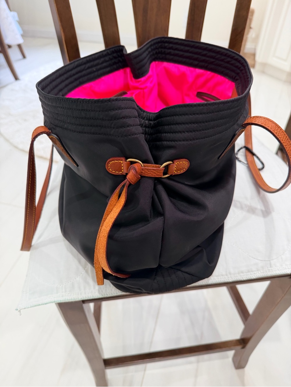 Dooney & Bourke Black Bucket Bag with Hot Pink Lining and Tan Straps